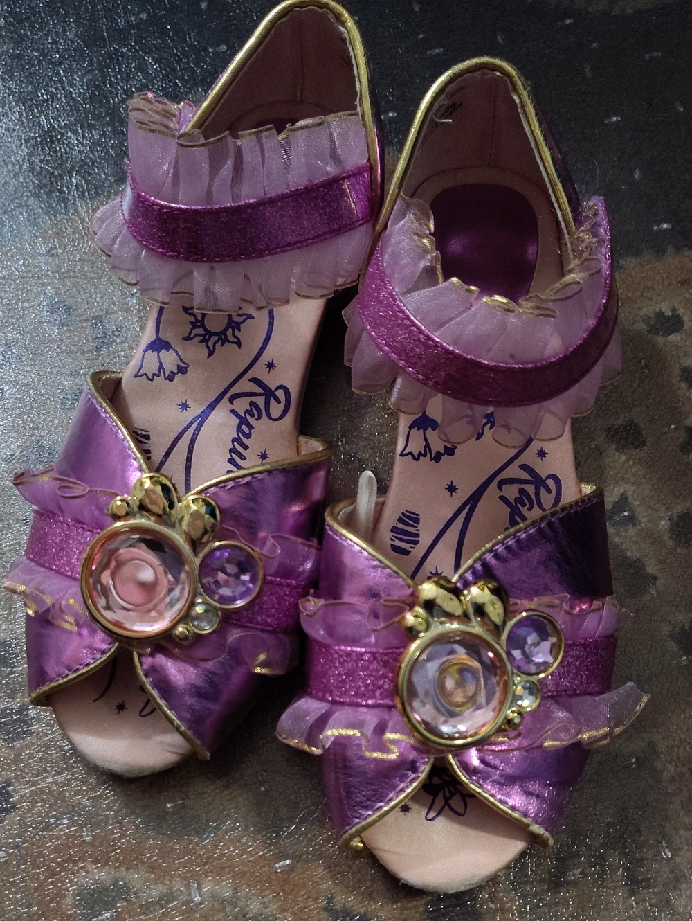 2/3 Rapunzel Slippers $25